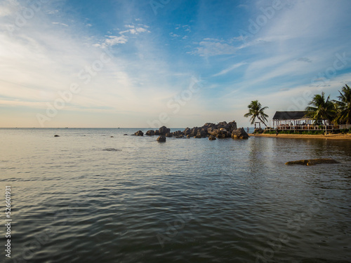 Beautiful view of idyllic beach with rocks and wooden beach bar in Vietnam © arianarama