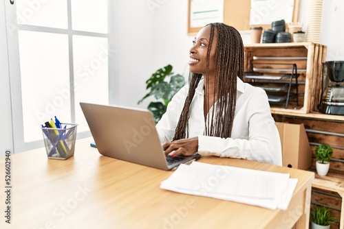 Young african american businesswoman smiling happy working at the office.