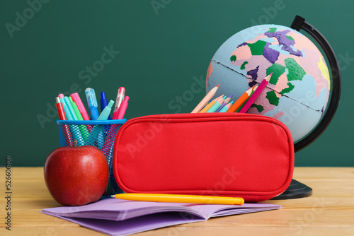 Red pencil case with school...