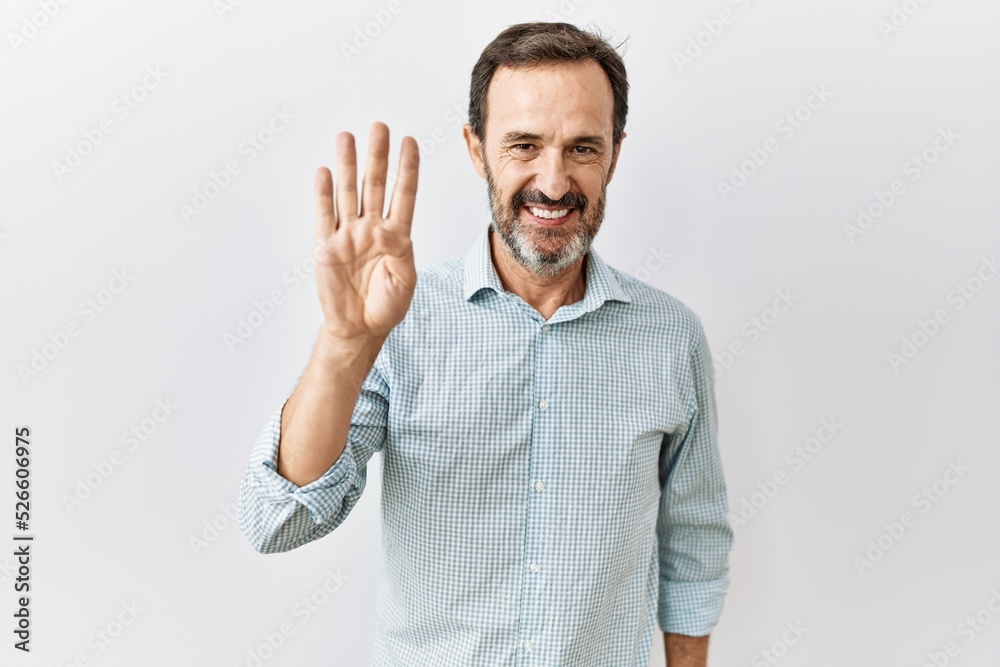 Middle age hispanic man with beard standing over isolated background showing and pointing up with fingers number four while smiling confident and happy. Middle age hispanic man with beard standing over isolated background showing and pointing up with fingers number four while smiling confident and happy.