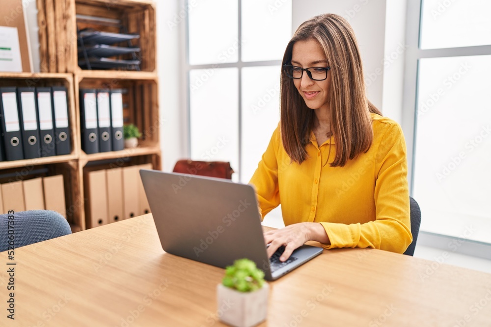 Young woman business worker using laptop working at office Young woman business worker using laptop working at office