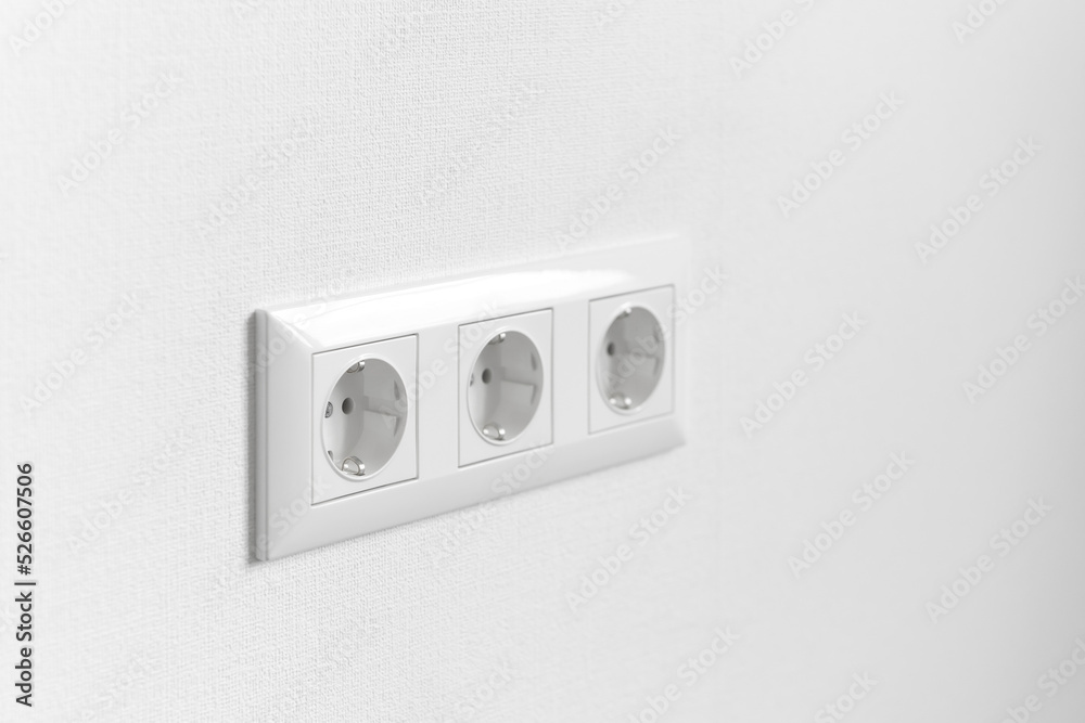 White electrical plastic socket on the renovated wall of a new house. A group of European electrical sockets in an apartment close-up.
Repair and power supply of residential apartments. House wiring. White electrical plastic socket on the renovated wall of a new house. A group of European electrical sockets in an apartment close-up.
Repair and power supply of residential apartments. House wiring.