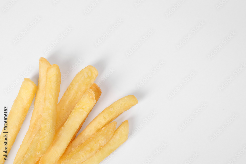Delicious french fries on white background, flat lay. Space for text Delicious french fries on white background, flat lay. Space for text