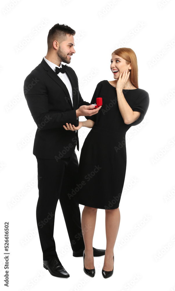 Man with engagement ring making marriage proposal to girlfriend on white background Man with engagement ring making marriage proposal to girlfriend on white background