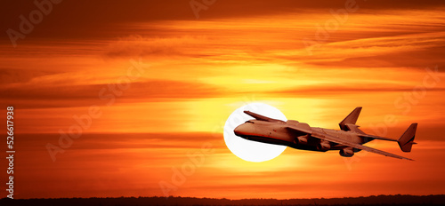 Big plane on the background of the sunset.