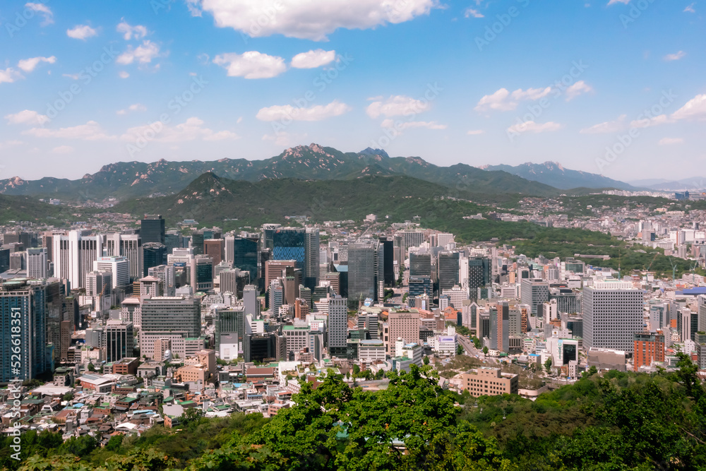 City building skyline and mountain view of downtown Seoul South Korea from Namsan tower