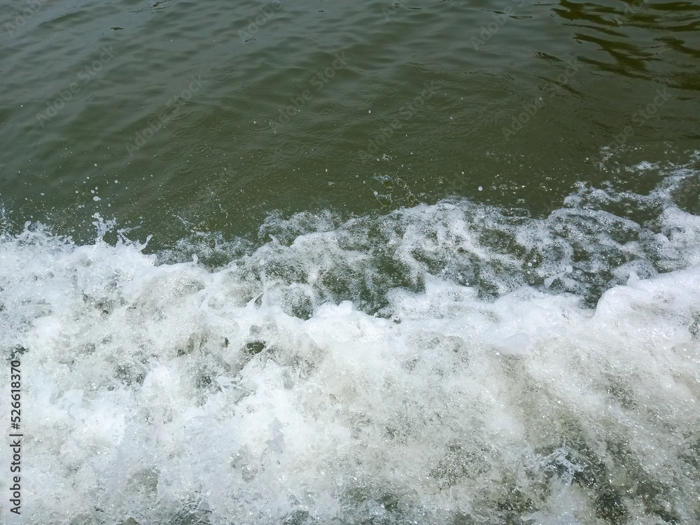 water foam from the movement of ships on the river