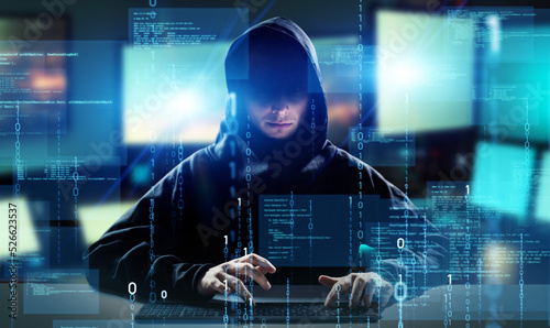 Hacker in PC room. Cyber crime. Wide image for banners, advertisements. photo