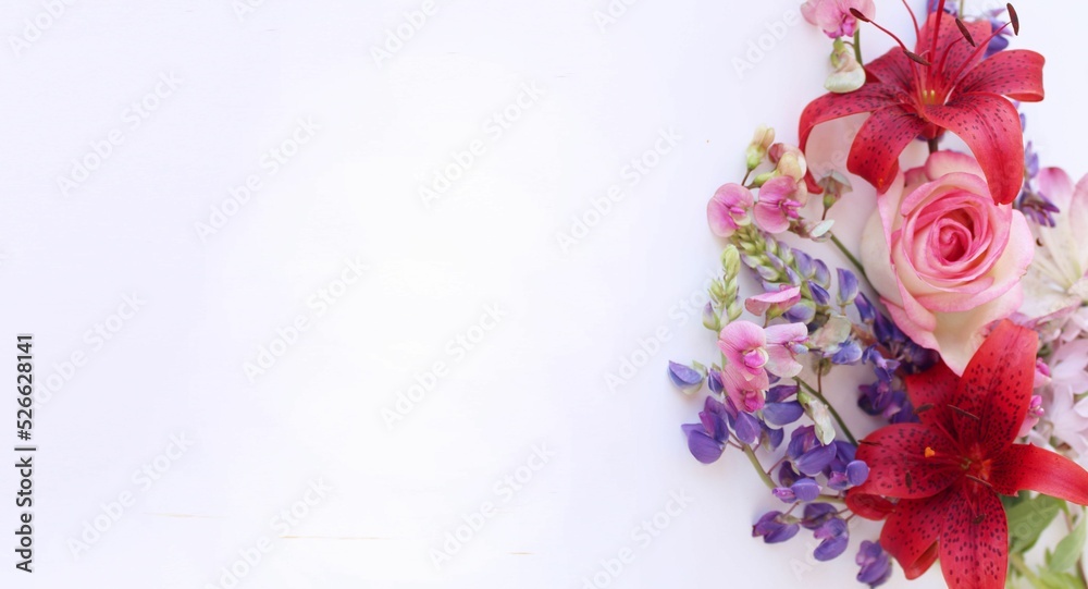 A festive bouquet with red lilies on a white background. A bright floral arrangement. Background for a greeting card. A festive bouquet with red lilies on a white background. A bright floral arrangement. Background for a greeting card.