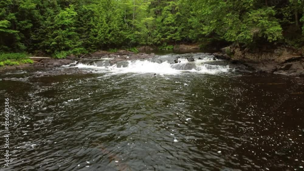 Drone image following the current at Oxtongue Falls at Algonquin Park, Ontario - Canada Drone image following the current at Oxtongue Falls at Algonquin Park, Ontario - Canada