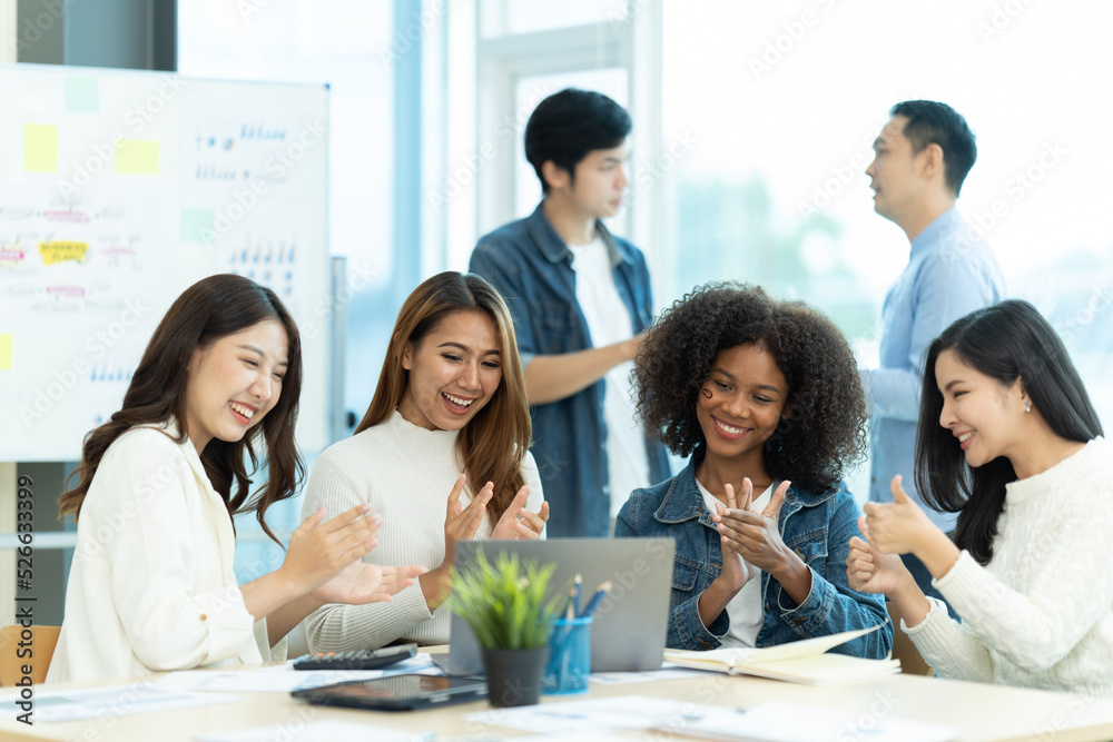 Business people showing team work while working in board room in office interior. People helping one of their colleague to finish new business plan. Business concept. Team work. Business people showing team work while working in board room in office interior. People helping one of their colleague to finish new business plan. Business concept. Team work.
