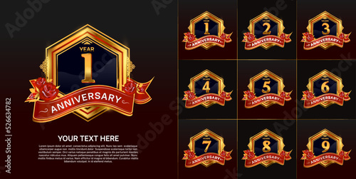 set of anniversary gold color with red ribbon for special moment celebration