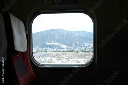 View of the railway window and the red seat. train in Japan.