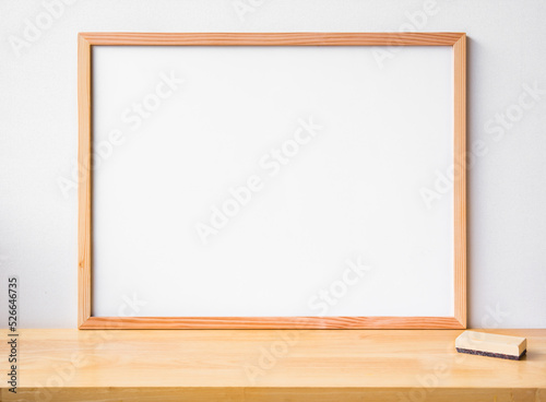 Blank white wood frame with Natural wood table texture isolated on wooden background. for add text message.