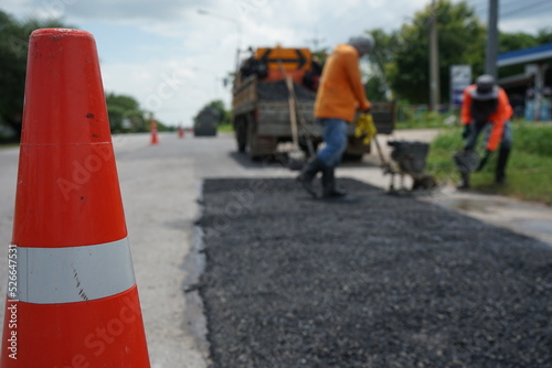 Blurred image of pavement repair work.