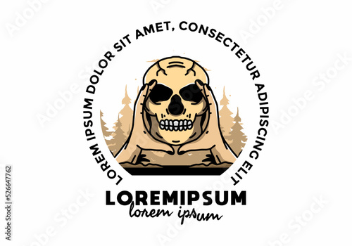 Two hand holding a skull illustration badge
