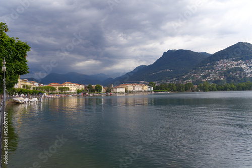 Scenic view of bay of Lake Lugano  Canton Ticino  on a cloudy summer day. Photo taken July 4th  2022  Lugano  Switzerland.