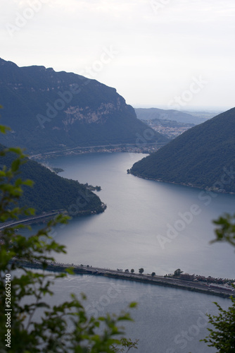 Aerial view from local mountain San Salvatore over region of Lugano  Canton Ticino  with Lake Lugano on a cloudy summer day. Photo taken July 4th  2022  Lugano  Switzerland.