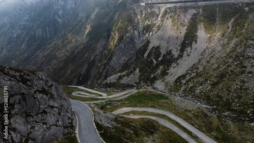 Drone footage of the Tremola Pass in Switzerland. Early in the morning on a foggy summers day. photo