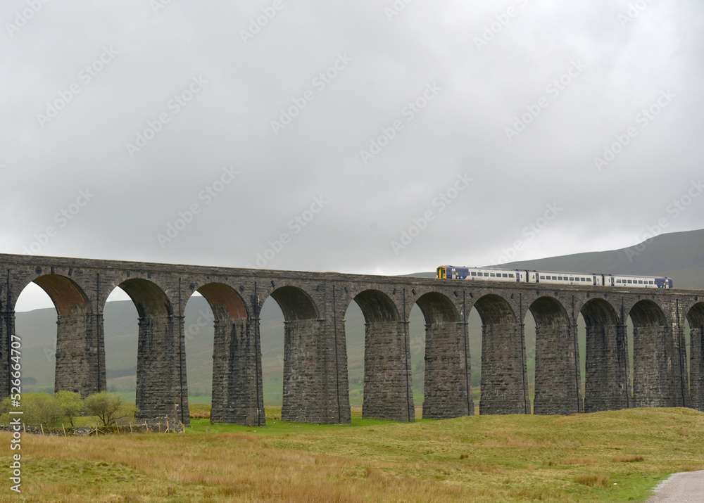 Train crossing Ribbleshead Viaduct in Yorkshire Dales