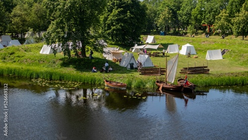 Fotografie, Obraz Reenactment of Bourtange 1650 army camp outside of the city with an old boat in