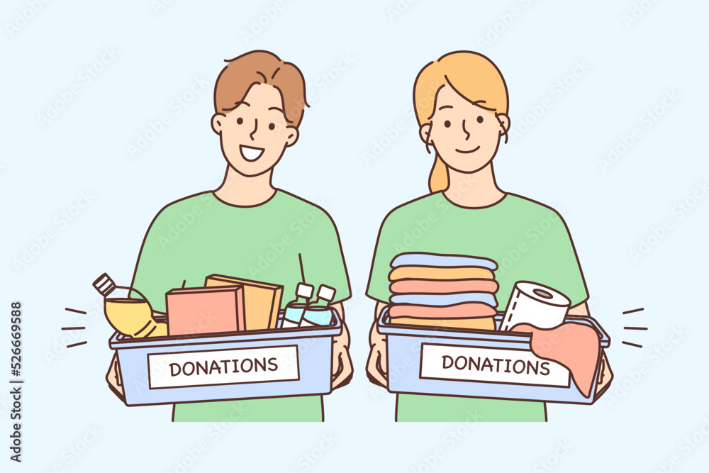 Happy volunteers with donation boxes Happy volunteers with donation boxes