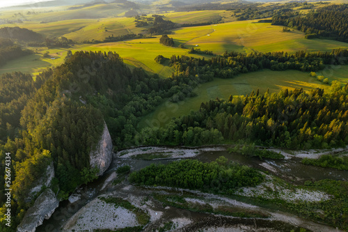 Fototapeta Naklejka Na Ścianę i Meble -  Bialka River in Podhale region, High tatras mountains in Poland at sunset. Drone View
