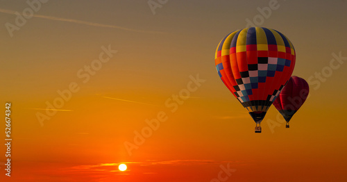 Obraz na płótnie Colorful hot air balloons flying on the sunset sky background. w salonie