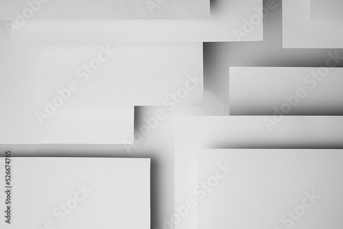White abstract geometric background with fly white surfaces as monochrome stylish pattern with rectangles, horizontal parallel stripes, shadows and perspective in elegant simple modern minimal style. photo