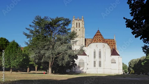 External view of Royal Monastery of Brou under deep blue sky. Ain department, central France. photo
