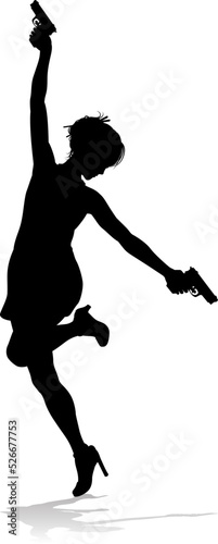 An action hero female movie star woman in silhouette. In a hitman, spy or secret agent detective type role halding a hand gun.