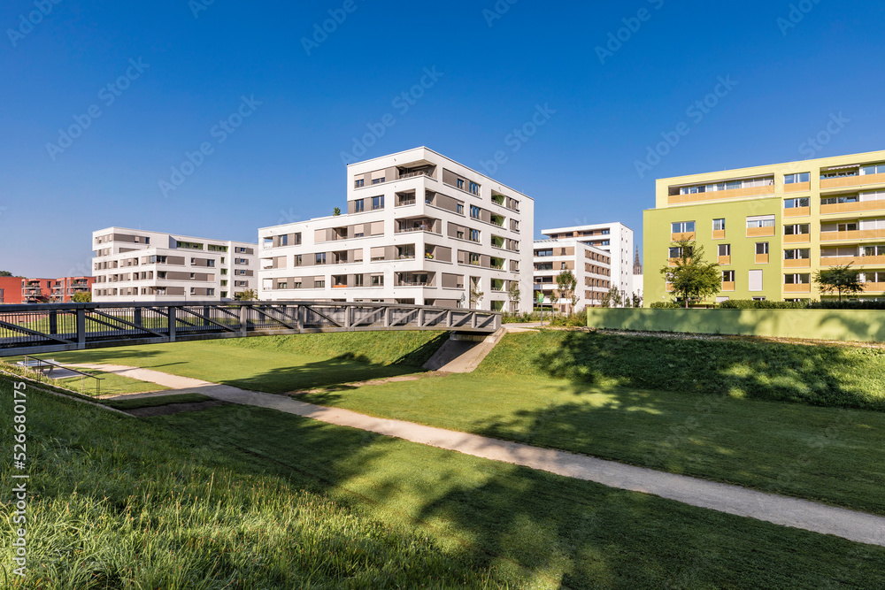 Germany, Baden-Wurttemberg, Ulm, Modern suburban apartments with elevated walkway in foreground Germany, Baden-Wurttemberg, Ulm, Modern suburban apartments with elevated walkway in foreground