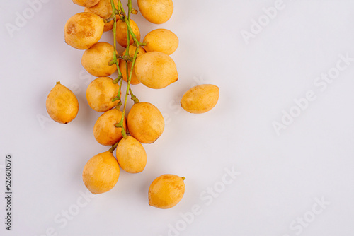 Thai fruit. Fresh ripe mafai with sweet and sour on white photo