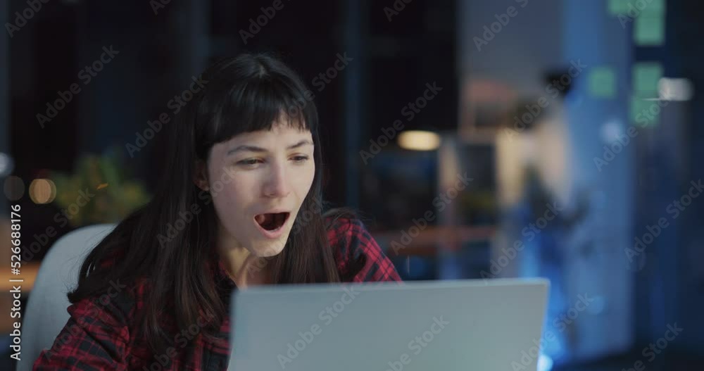 Excited young caucasian woman celebrating success wjhile reading good financial news on laptop screen. Successful woman. business concept. Excited young caucasian woman celebrating success wjhile reading good financial news on laptop screen. Successful woman. business concept.