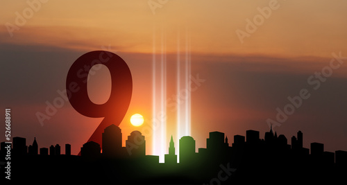 Fényképezés September 11 Tribute In Light Art Installation in the Lower Manhattan New York City Skyline at Sunset