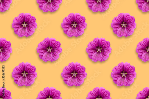 Pattern of purple flowers on a red background © Ignat