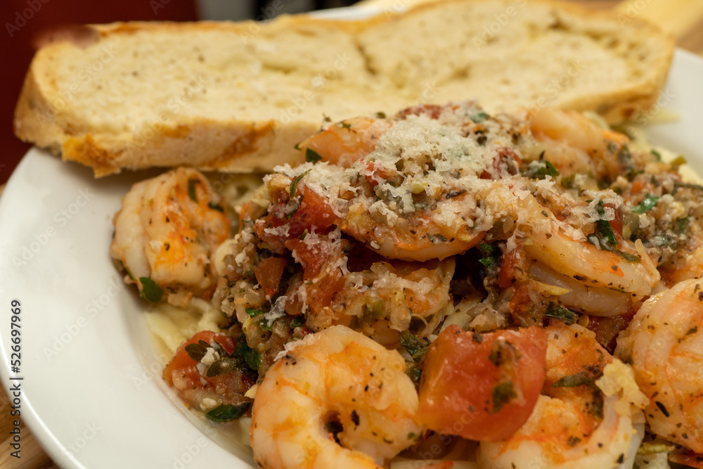 Shrimp Fra Diavolo Topped with Shaved Asiago Cheese served with a slice of Asiago Cheese Bread Shrimp Fra Diavolo Topped with Shaved Asiago Cheese served with a slice of Asiago Cheese Bread
