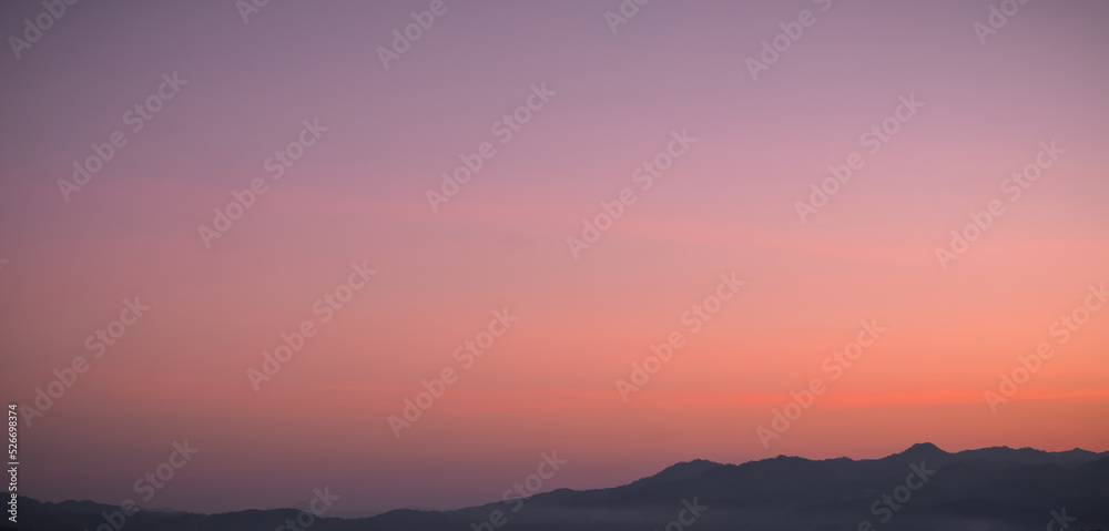 Beautiful bright cloud sky with light for heaven religion background. Sunrise and twilight or sunset cloudscape is orange and blue colours in summer nature.