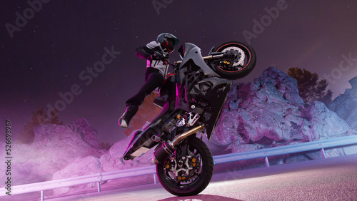 Moto rider making a stunt on his motorbike. Biker doing a difficult and dangerous stunt. photo
