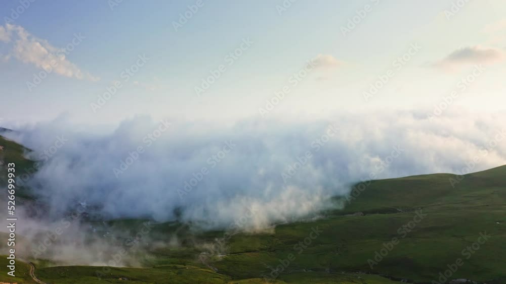 Dense Fog And Cloud Creeping Over Mountain Plateau At Sunset Dense Fog And Cloud Creeping Over Mountain Plateau At Sunset