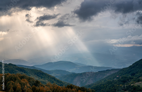 Beautiful summer mountain landscape, sky with clouds and sun rays at sunset