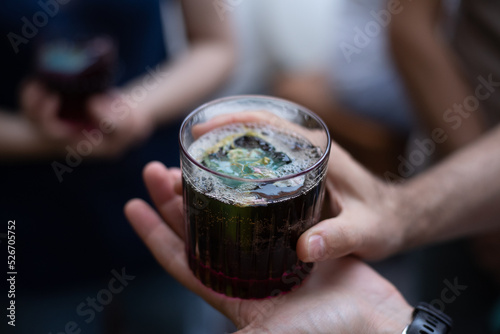 person holding a glass