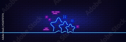Neon light glow effect. Stars line icon. Best ranking sign. Rating symbol. 3d line neon glow icon. Brick wall banner. Stars outline. Vector