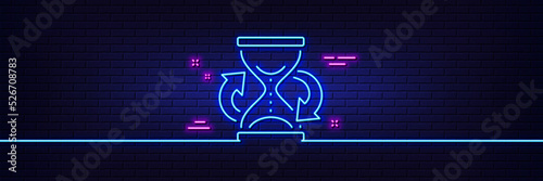 Neon light glow effect. Time hourglass refresh line icon. Sand watch sign. 3d line neon glow icon. Brick wall banner. Hourglass outline. Vector