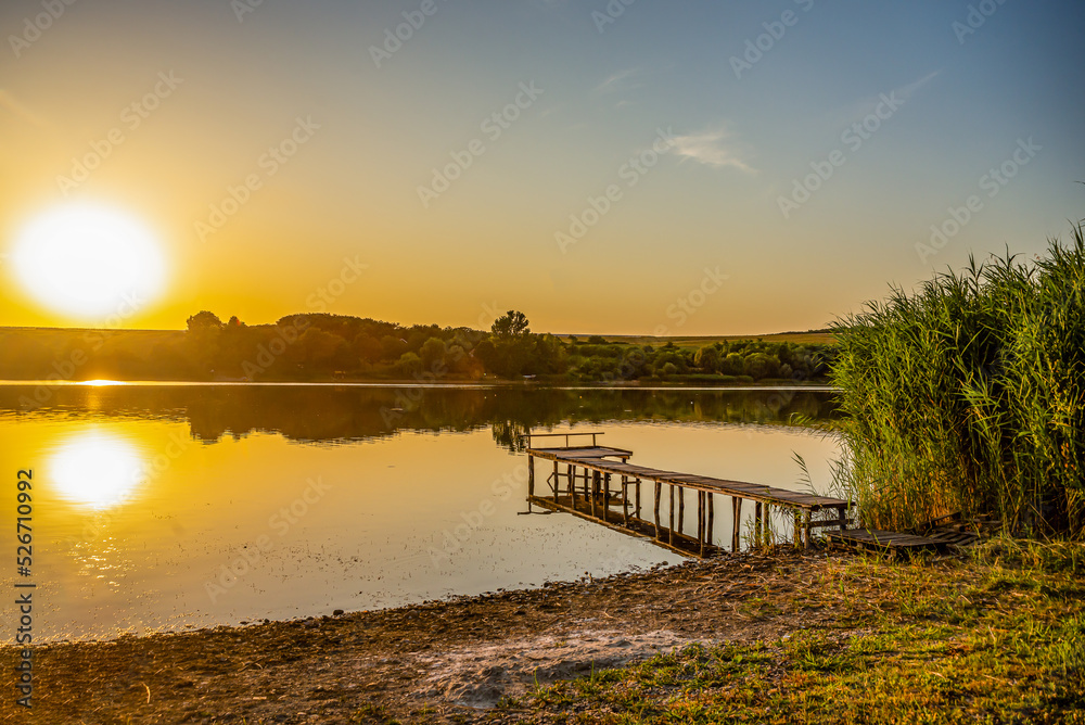 Fishing paradise on the lake under the sunset