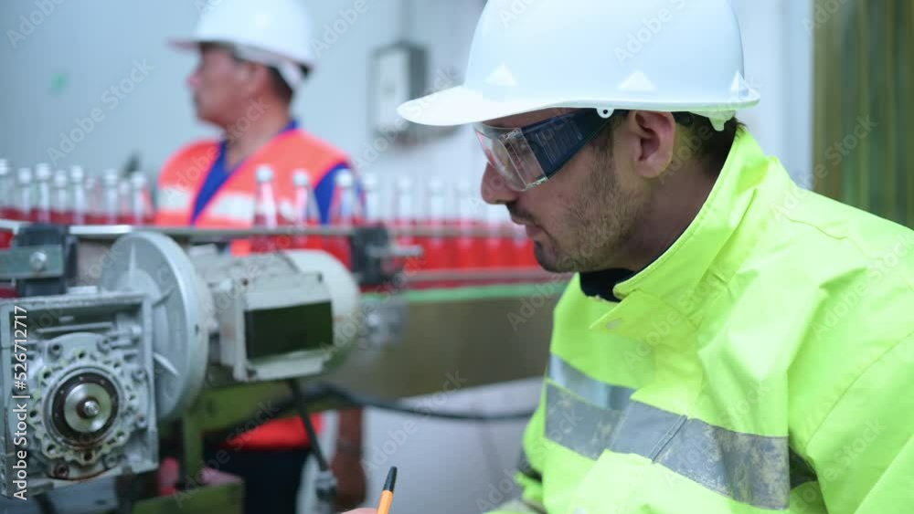 Chief Engineer of Mechanical Plant Inspecting the motor of the conveyor machinery to check the jammed working condition Chief Engineer of Mechanical Plant Inspecting the motor of the conveyor machinery to check the jammed working condition