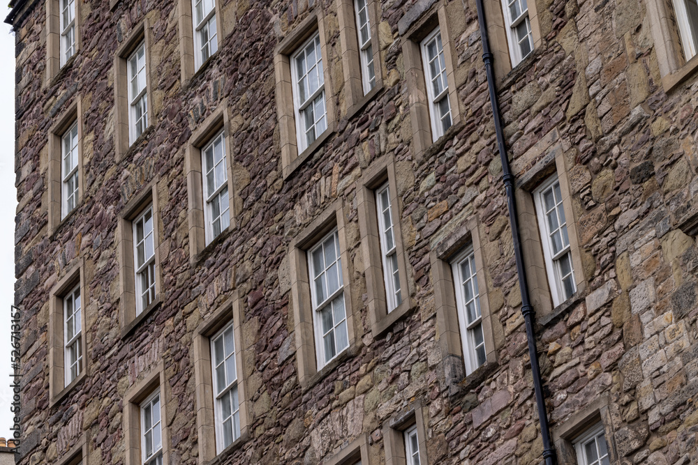 Sliding sash windows on historic stone wall period building UK