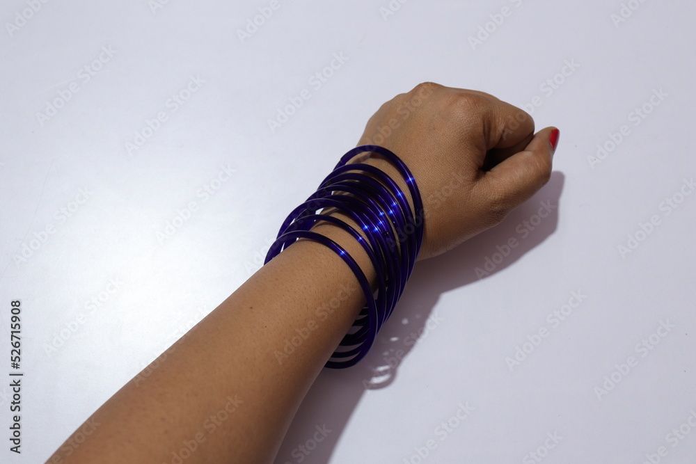 Woman's Blue Colour many bangles on her wrist Isolated white background ...