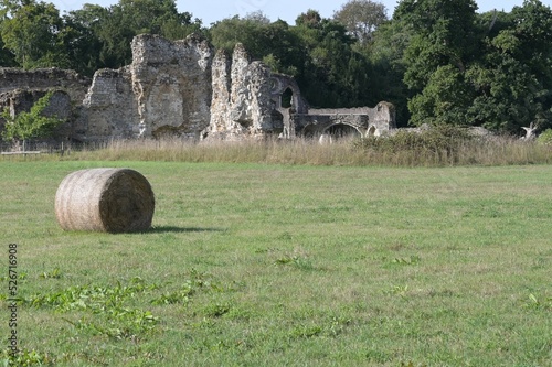 View of the ruins of a Norman abbey from a farmers field in the UK. #526716908