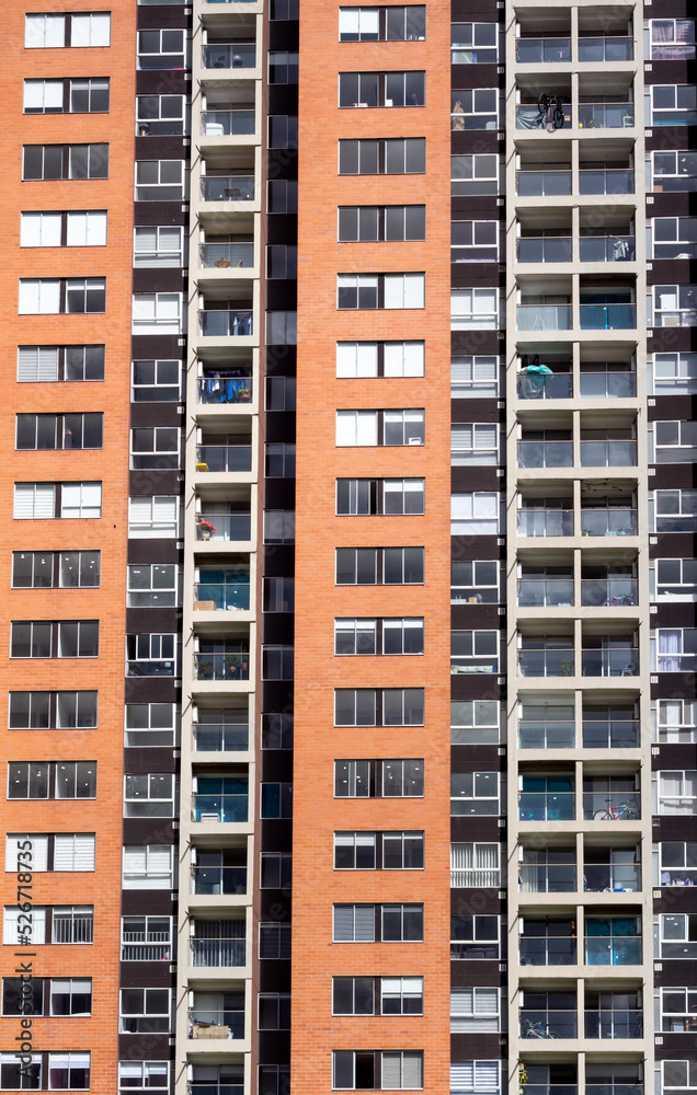 Facade of a residential building in San Jose de Bavaria, Bogota, Colombia. The picture shows bikes on the balconies.